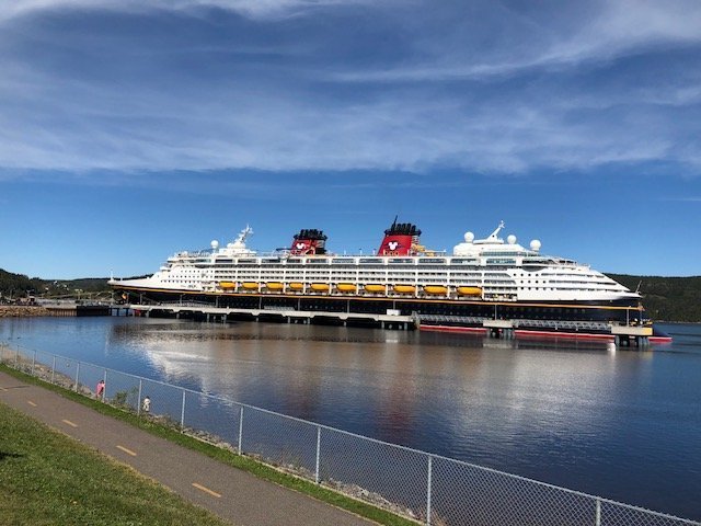 disney cruise line magic cruise ship in port in Saguenay, Canada choose itinerary