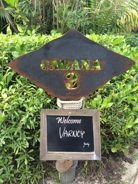 A metal sign marks the entrance to a private cabana on castaway cay