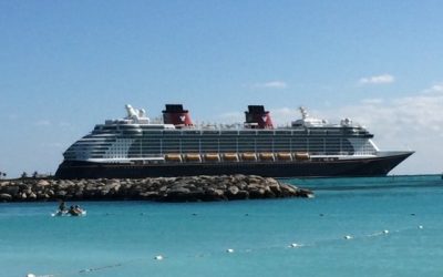 the Disney Dream docked at Disney Cruise Line's private island, Castaway Cay