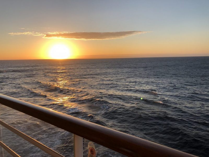 A sunset seen from the verandah of a stateroom on a Disney Cruise ship