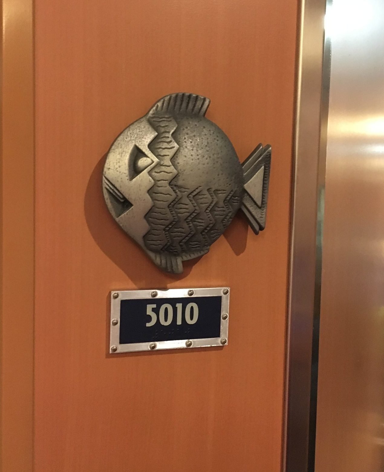 metal fish clip outside your disney cruise line stateroom first disney cruise
